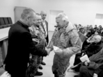 На знімку: голова райдержадміністрації Іван Стефанцов вручає відзнаку Володимиру Олійнику. В окопах біля Щастя