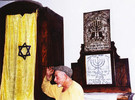 Beadle near ark and cabinet in Bershad synagogue, 2004 (courtesy of I.P. Weisz)